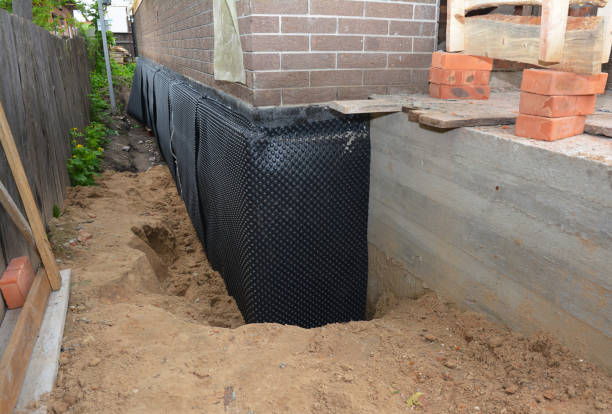 Happy homeowners after waterproofing job in Wilder